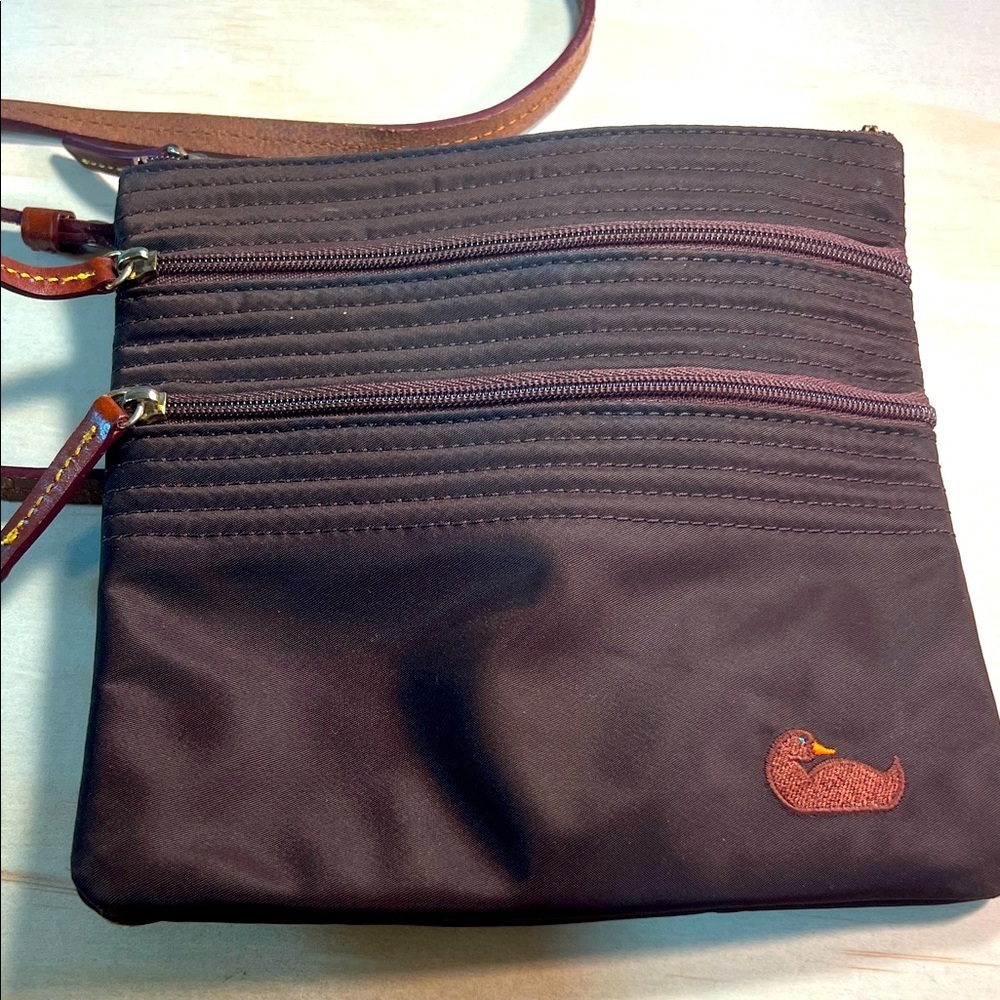 Dooney and Bourke North/South Triple Zip Nylon Brown Crossbody Bag.